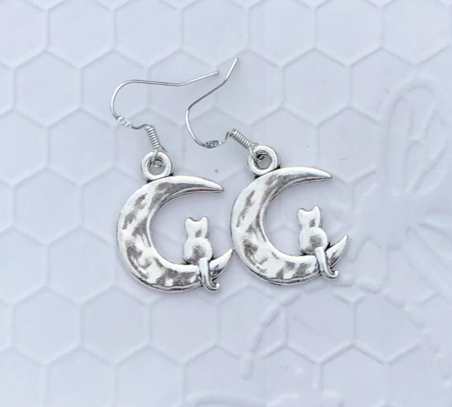 Talk about a statement piece! These cat earrings are one of the most unique accessories you can wear. They are the perfect jewelry gift for a cat-lover or for yourself! #catmom #catearrings #jewelry