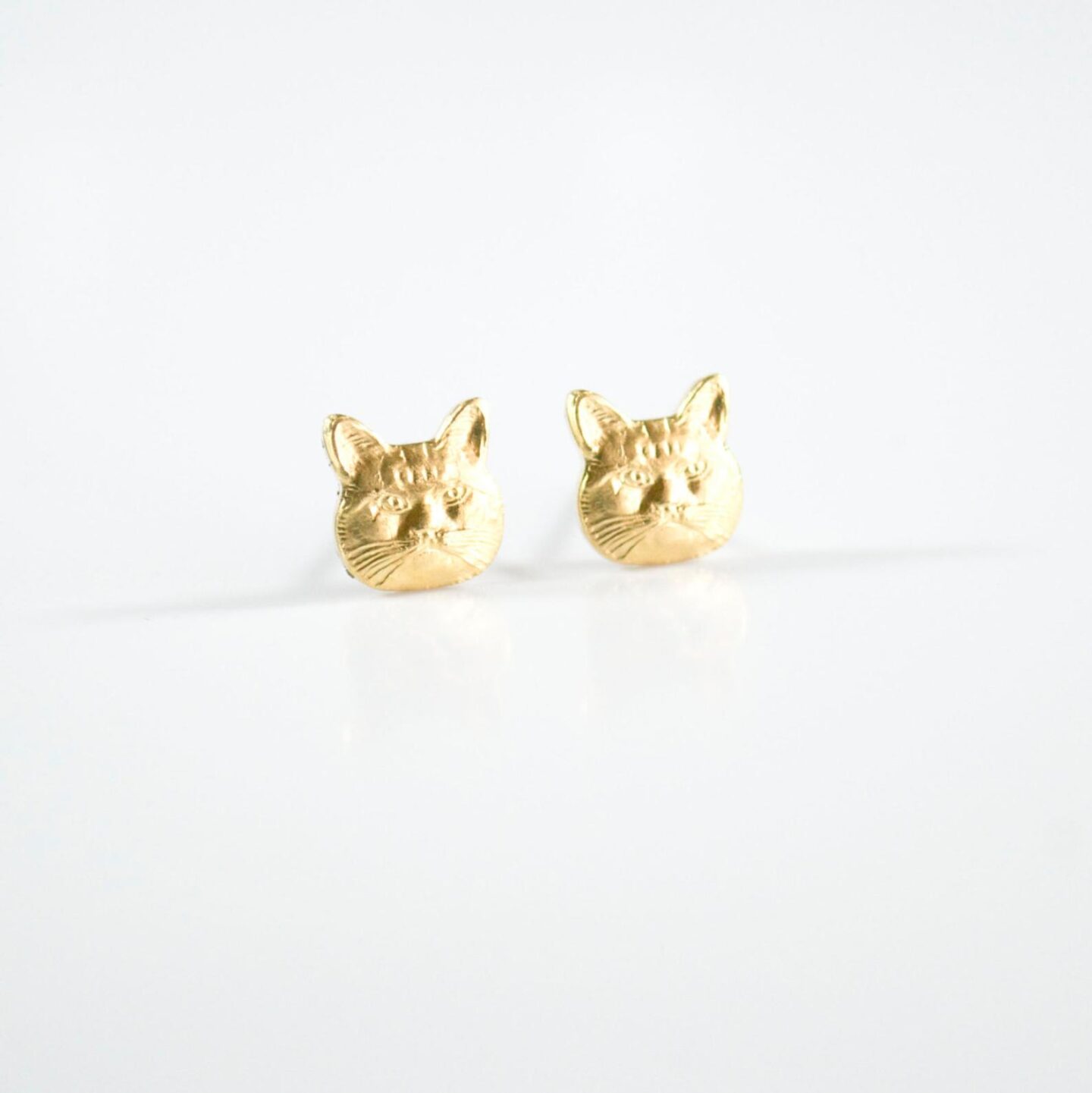 Talk about a statement piece! These cat earrings are one of the most unique accessories you can wear. They are the perfect jewelry gift for a cat-lover or for yourself! #catmom #catearrings #jewelry